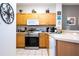 Bright kitchen with stainless steel appliances and wood cabinets at 8407 Crystal Cove Cv, Kissimmee, FL 34747