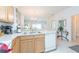 Kitchen features wood cabinets and a double sink at 8407 Crystal Cove Cv, Kissimmee, FL 34747