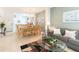Living room with sofa, coffee table, and dining area at 8407 Crystal Cove Cv, Kissimmee, FL 34747