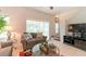 Living area with sofa, coffee table, and backyard access at 8407 Crystal Cove Cv, Kissimmee, FL 34747