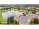 Apartment building near a lake with a fountain, showing location at 8660 Buccilli Dr # 305, Orlando, FL 32829
