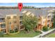 Aerial view showing building location and landscaping at 8660 Buccilli Dr # 305, Orlando, FL 32829
