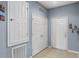 Clean entryway with tiled floor and extra storage at 8660 Buccilli Dr # 305, Orlando, FL 32829