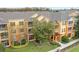 Apartment building with balconies, landscaping, and a covered entryway at 8660 Buccilli Dr # 305, Orlando, FL 32829