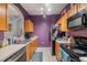 Kitchen with stainless steel appliances and wood cabinets at 8660 Buccilli Dr # 305, Orlando, FL 32829