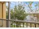 Peaceful lake view from screened balcony, showcasing nature's beauty at 8660 Buccilli Dr # 305, Orlando, FL 32829