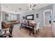 Living room with a brown couch and dining area at 8660 Buccilli Dr # 305, Orlando, FL 32829