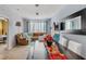 Living room with a brown couch and dining area at 8660 Buccilli Dr # 305, Orlando, FL 32829