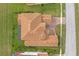 Bird's-eye view of a two-story house with a tile roof and a large backyard at 900 Windlass Ct, Kissimmee, FL 34746