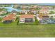 Community of luxury homes with waterfront access, showcasing a variety of architectural styles at 900 Windlass Ct, Kissimmee, FL 34746