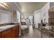 This bathroom offers a soaking tub, shower, and vanity with plentiful storage space at 900 Windlass Ct, Kissimmee, FL 34746