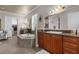 Luxurious bathroom features a soaking tub, double vanity, and access to a walk-in closet at 900 Windlass Ct, Kissimmee, FL 34746