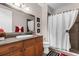 Bright bathroom includes a shower, vanity with ample storage, mirror, and toilet at 900 Windlass Ct, Kissimmee, FL 34746