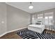 Cozy bedroom with a white bed, neutral decor, and ample natural light at 900 Windlass Ct, Kissimmee, FL 34746