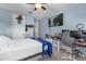 Bedroom with a bed, desk, and wall-mounted TV at 900 Windlass Ct, Kissimmee, FL 34746