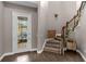 Elegant entryway with hardwood floors, staircase, and decorative accents at 900 Windlass Ct, Kissimmee, FL 34746