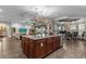 Open-concept kitchen with a large island that flows into the living and dining areas, perfect for entertaining at 900 Windlass Ct, Kissimmee, FL 34746