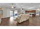Spacious open-concept living area with patio access and view of modern kitchen at 900 Windlass Ct, Kissimmee, FL 34746