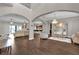 Spacious open-concept living room featuring elegant archways and hardwood floors at 900 Windlass Ct, Kissimmee, FL 34746