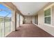 Wide angle view of a covered patio with brick flooring and a view of nature at 900 Windlass Ct, Kissimmee, FL 34746