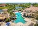 Aerial view of the community pool, playground, and lakeside homes in the neighborhood at 900 Windlass Ct, Kissimmee, FL 34746