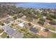 Aerial view showcasing home's location near a lake at 11322 Bronson Rd, Clermont, FL 34711