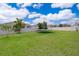 Large backyard with grassy area and trampoline at 11322 Bronson Rd, Clermont, FL 34711