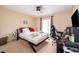 Comfortable bedroom with a queen-size bed and workspace at 11322 Bronson Rd, Clermont, FL 34711