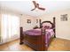 Guest bedroom with ceiling fan and large window at 11322 Bronson Rd, Clermont, FL 34711