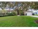 Single-story home with a large yard and mature trees at 11322 Bronson Rd, Clermont, FL 34711