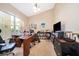 Home office featuring a large desk, bookcase, and TV at 11322 Bronson Rd, Clermont, FL 34711