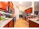 Spacious kitchen with granite countertops and wood cabinets at 11322 Bronson Rd, Clermont, FL 34711
