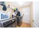 Bright laundry room with washer, dryer, and ample storage at 11322 Bronson Rd, Clermont, FL 34711