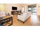 Open living room offering lots of natural light and access to patio at 11322 Bronson Rd, Clermont, FL 34711