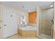 Bathroom with corner soaking tub and walk-in shower at 12544 Floridays Resort Dr, Orlando, FL 32821