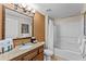 Bathroom with tub, shower, and granite vanity at 12544 Floridays Resort Dr, Orlando, FL 32821