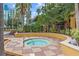 Enjoy a relaxing soak in this hot tub, nestled in a lush landscape at 12544 Floridays Resort Dr, Orlando, FL 32821