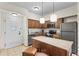 Kitchen with island and stainless steel appliances at 12544 Floridays Resort Dr, Orlando, FL 32821