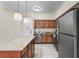 Modern kitchen with granite countertops and stainless steel appliances at 12544 Floridays Resort Dr, Orlando, FL 32821