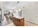 Open concept kitchen and dining area with granite island at 12544 Floridays Resort Dr, Orlando, FL 32821
