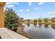 Lake view with fountain and lush landscaping at 12544 Floridays Resort Dr, Orlando, FL 32821