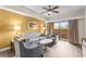 Living room with comfy seating, hardwood floors and balcony access at 12544 Floridays Resort Dr, Orlando, FL 32821