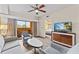 Living room with balcony access and view of condo bedroom at 12544 Floridays Resort Dr, Orlando, FL 32821