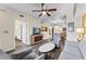 Open living room with view of kitchen and dining area at 12544 Floridays Resort Dr, Orlando, FL 32821
