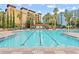 Inviting swimming pool with clear water and palm trees at 12544 Floridays Resort Dr, Orlando, FL 32821