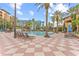 Resort-style pool with lounge chairs and palm trees at 12544 Floridays Resort Dr, Orlando, FL 32821