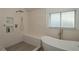 Spa-like bathroom with freestanding tub, walk-in shower, and dual sinks at 1933 Island Walk Dr, Orlando, FL 32824