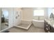 Spa-like bathroom with freestanding tub, walk-in shower, and dual sinks at 1933 Island Walk Dr, Orlando, FL 32824