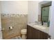 Updated bathroom with granite vanity, tiled shower, and modern fixtures at 1933 Island Walk Dr, Orlando, FL 32824