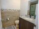 Updated bathroom with granite vanity, tiled shower, and modern fixtures at 1933 Island Walk Dr, Orlando, FL 32824